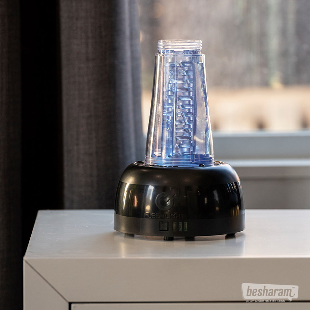 Fleshlight Air Automatic Dryer shown with sleeve mounted for drying