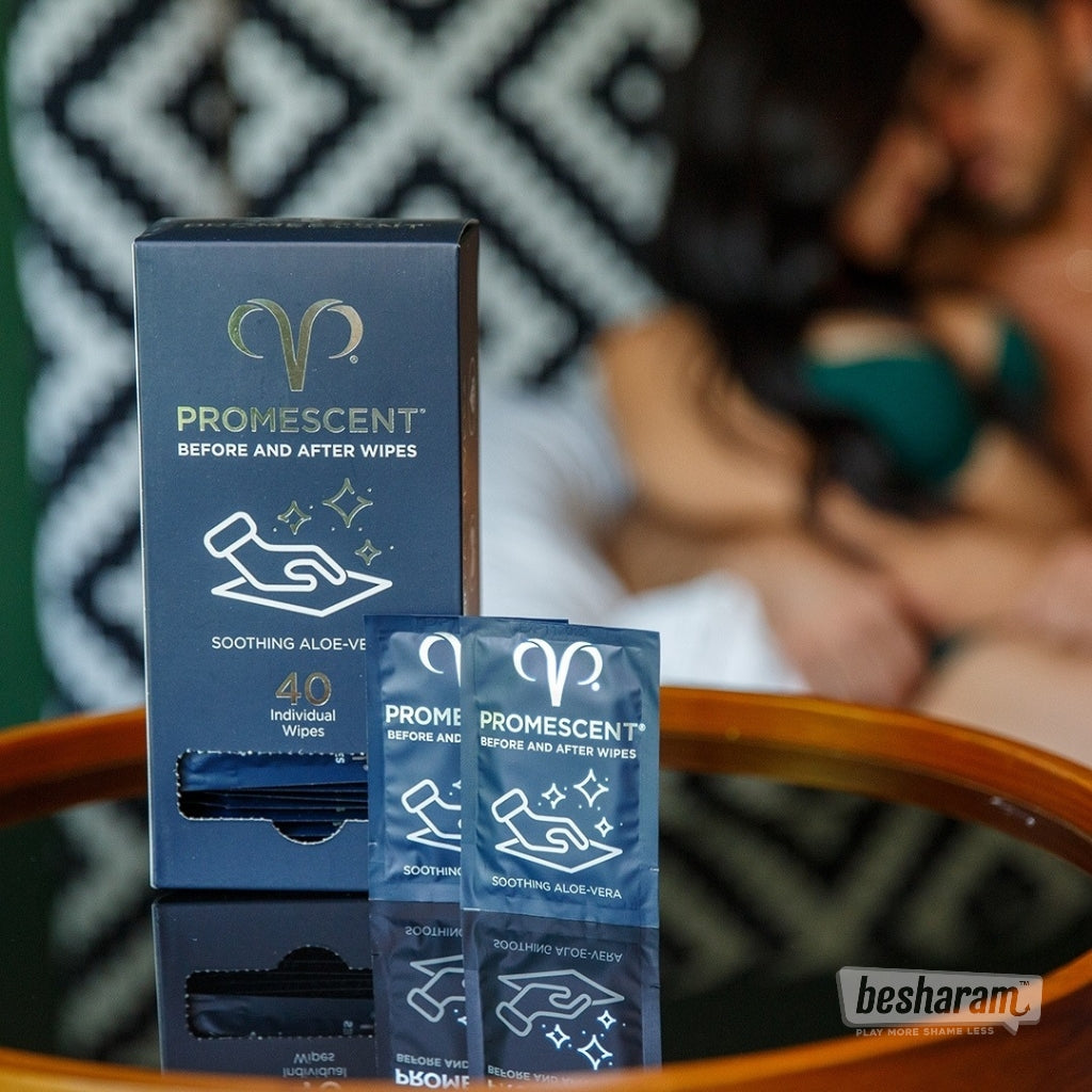 Promescent Before and After Wipes box with two sachets on a table, with a couple blurred in the background.