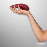 Womanizer Premium 2 Clitoral Vibrator Bordeaux Flat in Hand