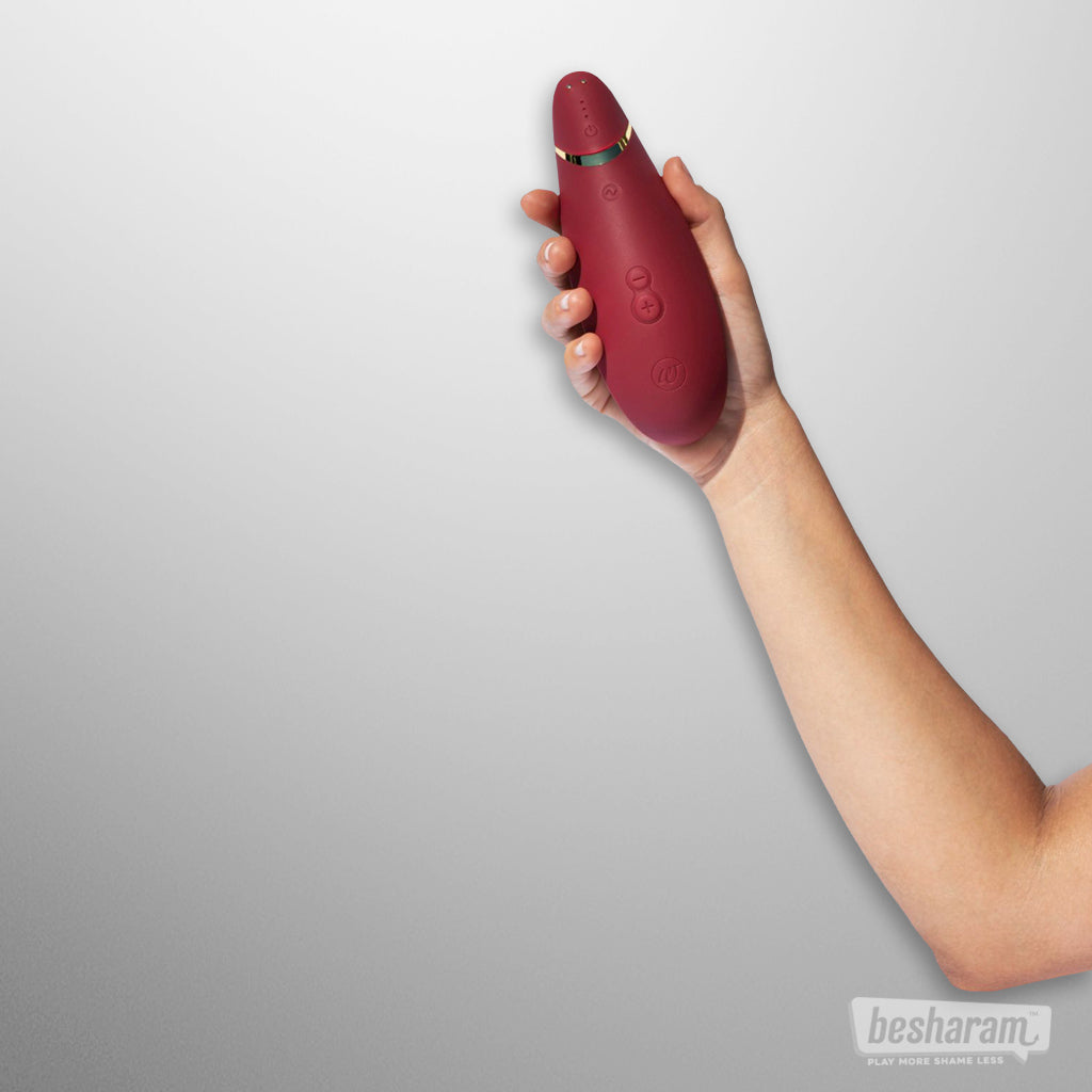 Womanizer Premium 2 Clitoral Vibrator Bordeaux in hand