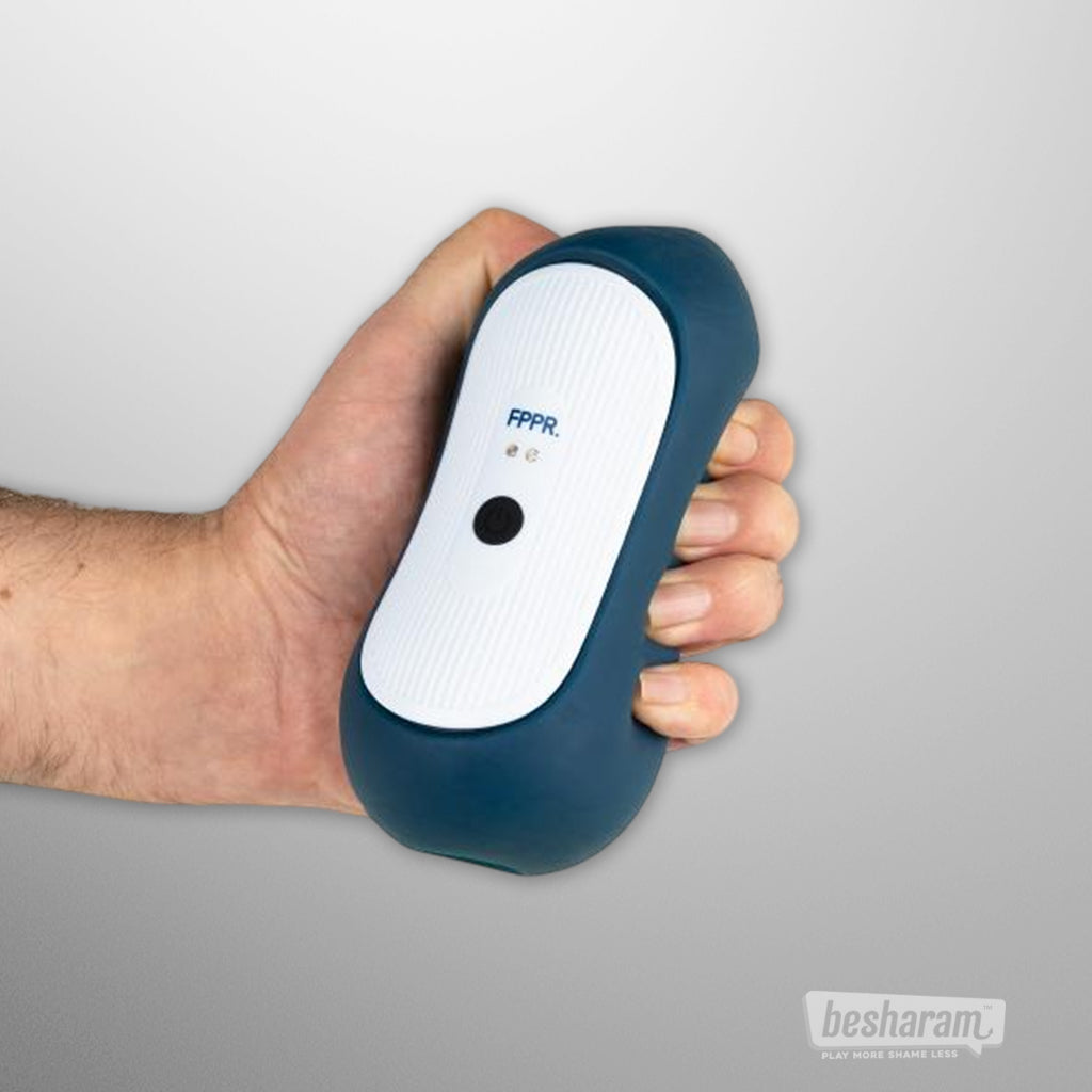 FPPR Squeezable Vibrating Masturbator shown in hand to highlight grip and size