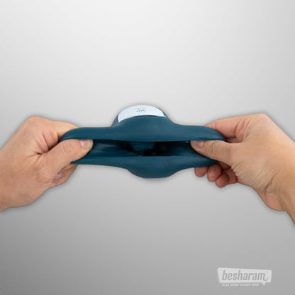 FPPR Squeezable Vibrating Masturbator shown stretched by hand to highlight flexible design