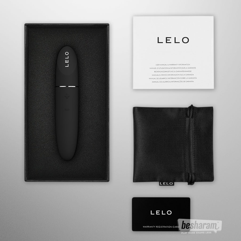 LELO Mia 3 vibrator unboxed with accessories, black silicone personal vibrator shown with pouch charger manual and warranty card