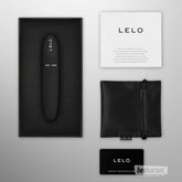 LELO Mia 3 vibrator unboxed with accessories, black silicone personal vibrator shown with pouch charger manual and warranty card