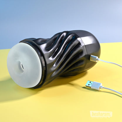 Playboy Solo Vibrating and Sucking Masturbator connected to USB charging cable
