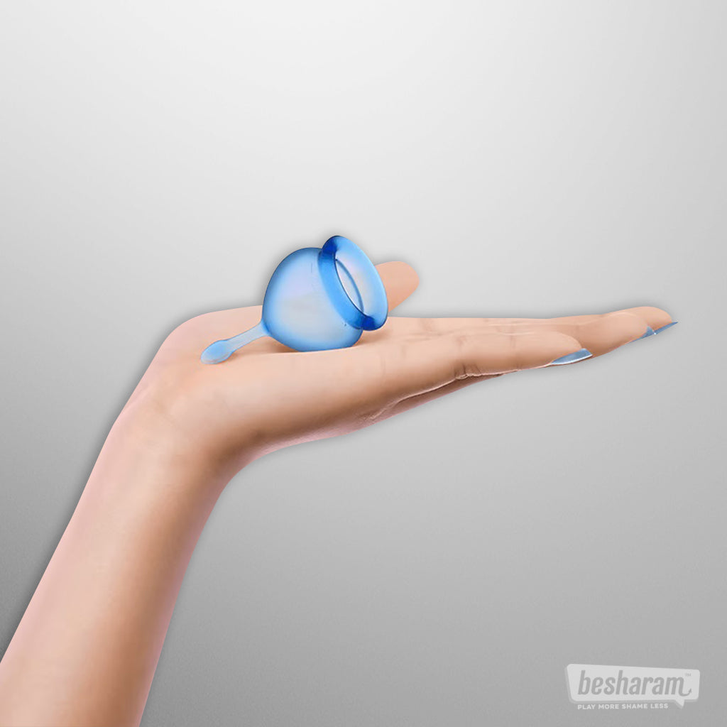 Satisfyer Feel Good Menstrual Cup shown in hand to highlight compact size and soft silicone design