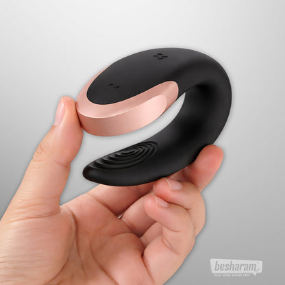 Close-up of Satisfyer Double Love black couples vibrator held in hand showing flexible ergonomic design for dual stimulation