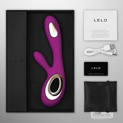 LELO Soraya Wave vibrator unboxed with accessories, purple silicone rabbit vibrator shown with charger pouch manual and warranty card