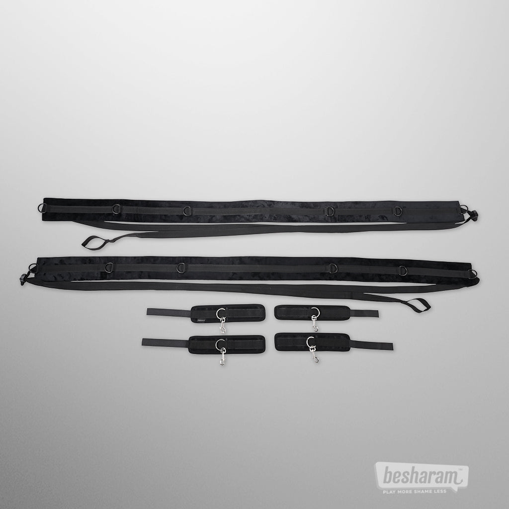 Sportsheets no matter where restraint system with adjustable straps and four padded wrist and ankle cuffs laid out on white background