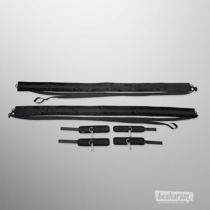 Sportsheets no matter where restraint system with adjustable straps and four padded wrist and ankle cuffs laid out on white background