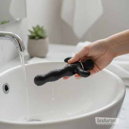 Anal Fantasy 9 waterproof prostate massager being rinsed under running water for easy cleaning