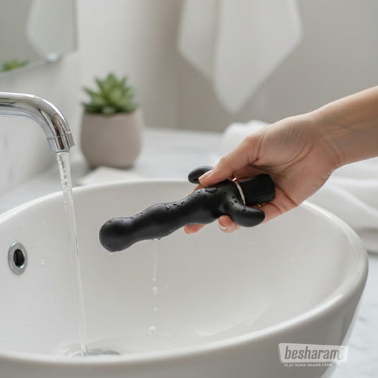 Anal Fantasy 9 waterproof prostate massager being rinsed under running water for easy cleaning