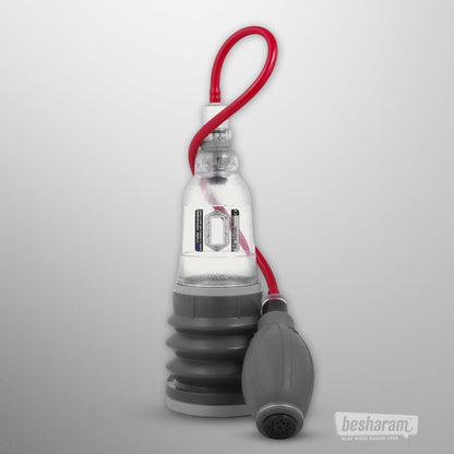 Clear Bathmate Hydroxtreme 3 water penis pump with red hose and ergonomic hand pump isolated on light background