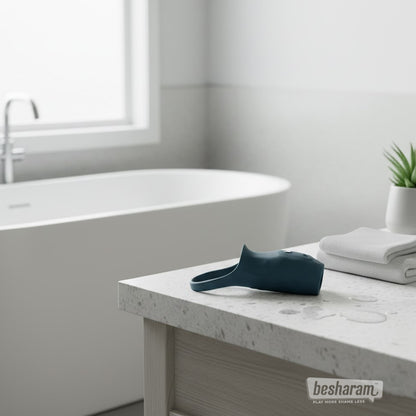 Boners vibrating penis sleeve displayed on bathroom counter near bathtub and towels