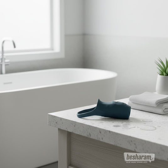 Boners vibrating penis sleeve displayed on bathroom counter near bathtub and towels