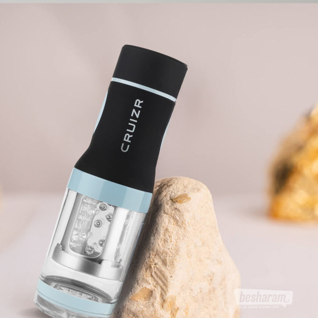 CRUIZR rotating male masturbator with textured inner sleeve displayed upright on stone surface