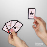 Kamasutra Pocket playing cards with illustrated position cards and joker card in hand