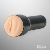 Kiiroo Feel Lacy male masturbator sleeve attached to black power case
