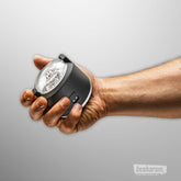 Hand holding the Kiiroo PowerShot automatic stroker showing its compact design