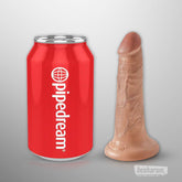 Kink Cock 5 inch realistic dildo shown beside a soda can for accurate size comparison
