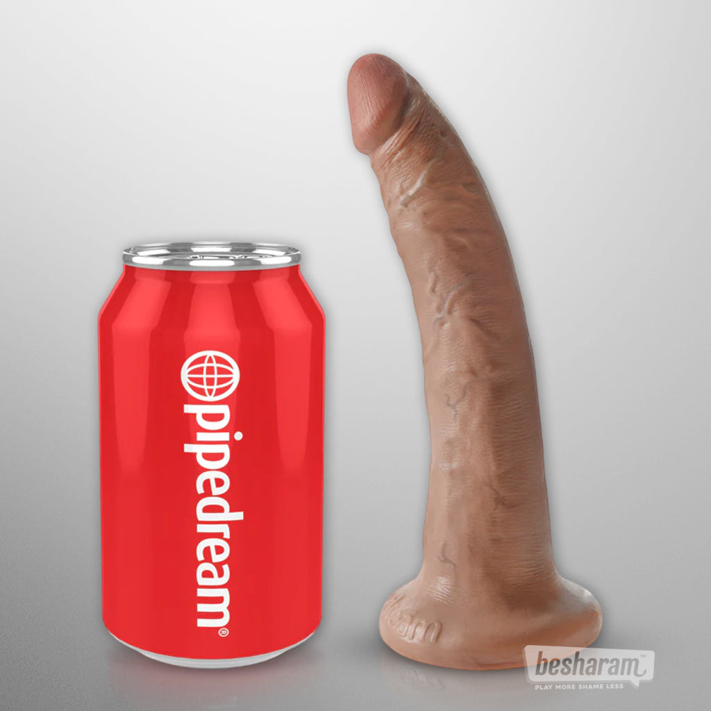 7 inch realistic King Cock dildo standing next to a beverage can for clear size comparison on white background