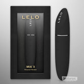 LELO MIA 3 black personal vibrator shown next to its retail box on a neutral background