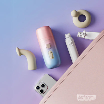 Lovense Spinel thrusting dildo with curved head, clitoral ring, handle, and accessories in a travel-friendly layout