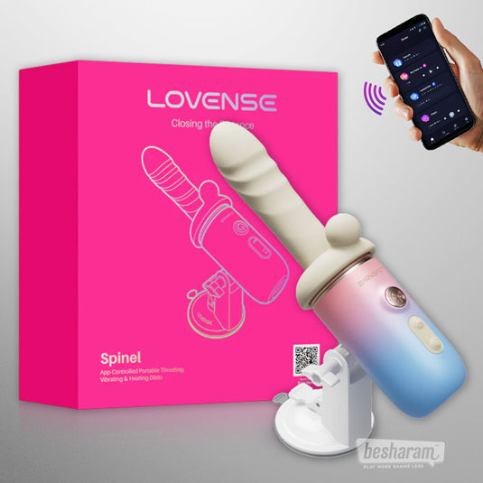 Lovense Spinel app-controlled thrusting dildo displayed with retail box and phone app