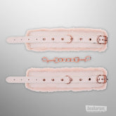 Back view of blush pink faux fur handcuffs with adjustable buckle straps and rose gold hardware
