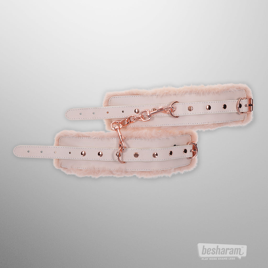 Soft faux fur bondage cuffs with detachable rose gold chain and adjustable wrist straps
