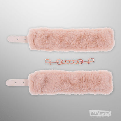 Peaches n Creame faux fur handcuffs in soft blush pink with rose gold chain connector front view