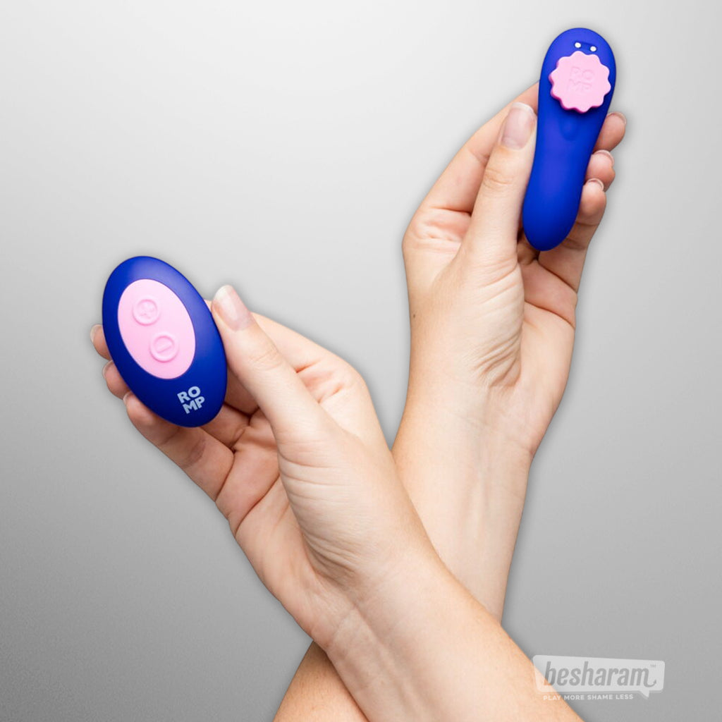 Wireless remote control for ROMP Party panty vibrator shown held in hand
