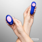 Wireless remote control for ROMP Party panty vibrator shown held in hand