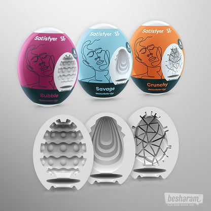 Three Satisfyer products with colorful packaging on a gray background