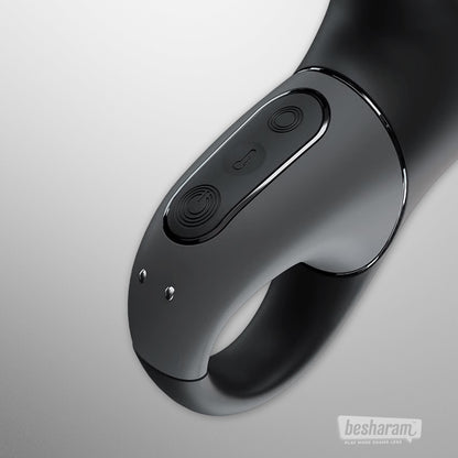 Close-up view of the Satisfyer Heat Climax+ control handle showing power, vibration, and heat buttons with magnetic charging pins.