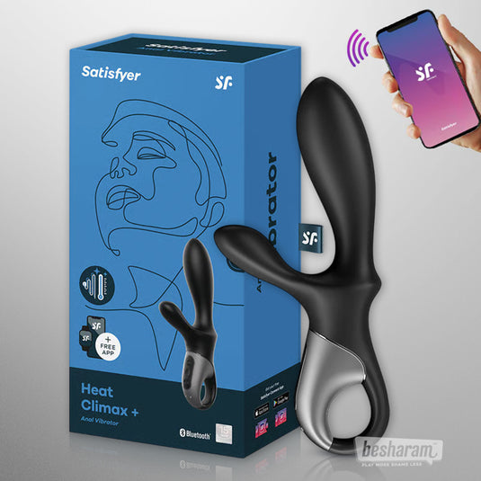 Satisfyer Heat Climax+ anal vibrator displayed next to its blue retail box, with a hand holding a smartphone showing app control.