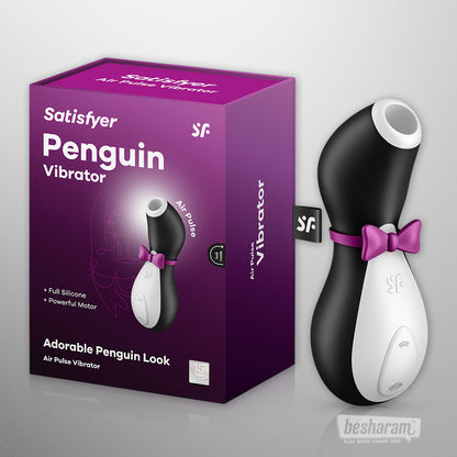 Satisfyer Penguin air pulse vibrator with cute penguin design, black and white silicone clitoral stimulator shown with retail box, hands free suction vibrator for external pleasure