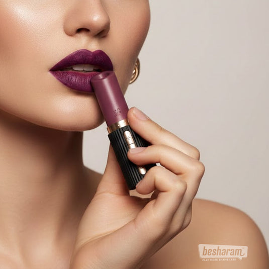 Close-up of a woman applying lipstick-style clitoral vibrator to her lips, showcasing the discreet design and elegant finish.