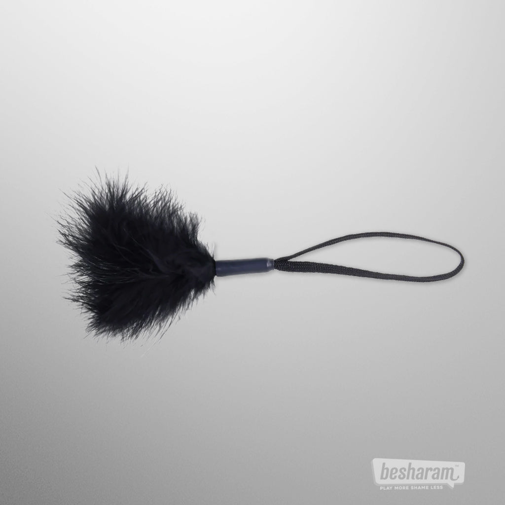 Black feather tickler with wrist strap by Sex &amp; Mischief for sensual teasing