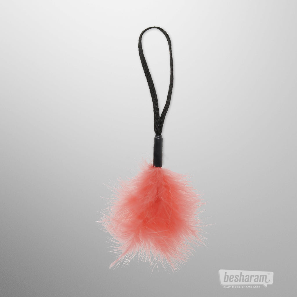 Soft peach feather tickler wrist teaser from Sex &amp; Mischief for sensual touch play