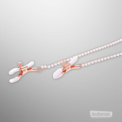 Rose gold nipple clamps with soft tips and pearl chains from Sex &amp; Mischief