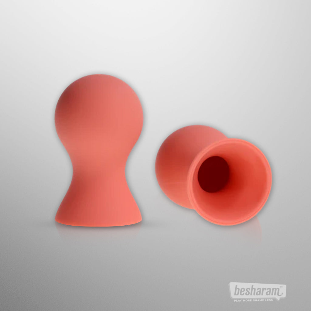 Sex &amp; Mischief Peaches n Creame silicone nipple suckers in peach color shown from front and side view
