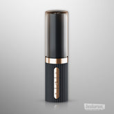 Sleek black and gold libstick vibrator with a ribbed grip, vertical control buttons, and a smooth cylindrical top shown on a light background.