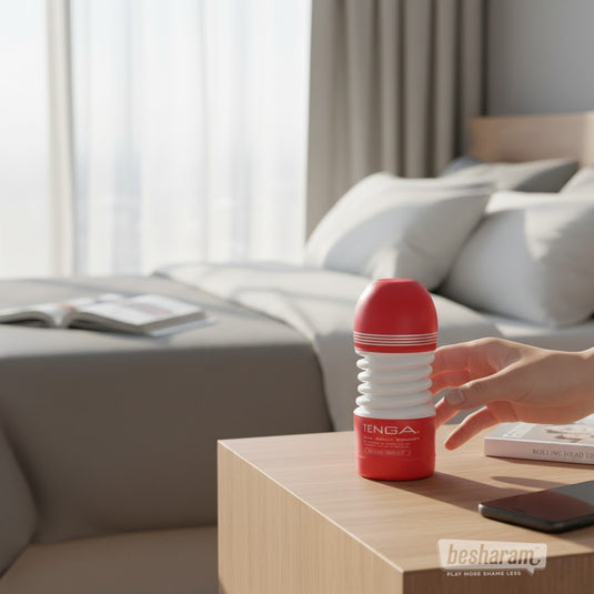 Tenga Rolling Head Cup masturbator placed on bedside table in a modern bedroom setting
