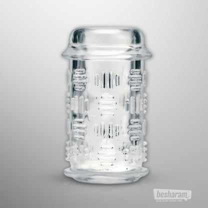 Clear textured masturbator sleeve with raised grip details and ribbed inner texture