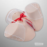 Torso sex doll styled with white mesh lingerie and ribbon detail