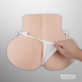 Rear view of torso sex doll wearing white briefs on plain background